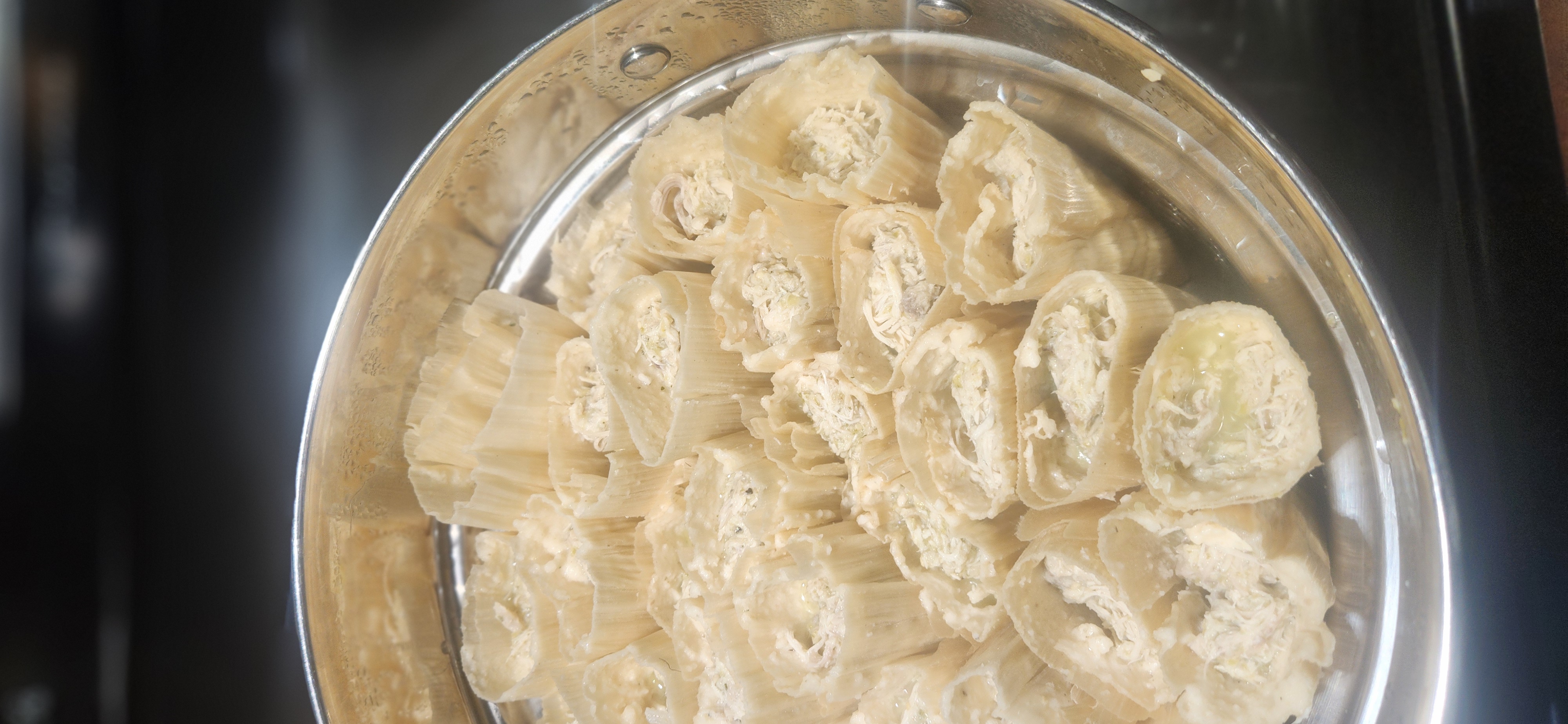 Chicken tamales prepared in a steamer pot